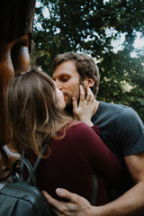 Fototapeta premium love story. stroll. beloved family and dog. future mom and dad. Pregant woman