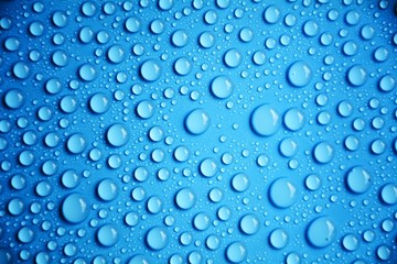 drops water on blue background