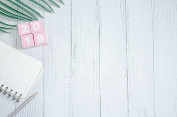 Pink square wood with white numbers 2019.Copy space.