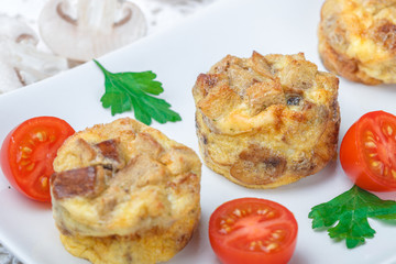 Omelette with mushrooms, parsley, cherry tomatoes and bread croutons.  Scrambled eggs. Tortilla. Frittata. Traditional tasty Breakfast. Brunch