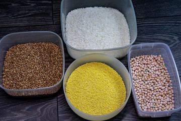 Grain of rice, peas, millet, buckwheat on a wooden table.