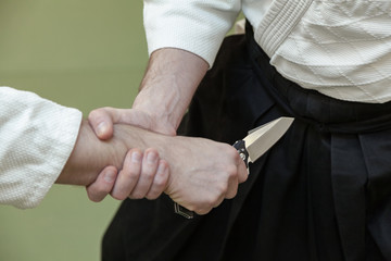 Self defense disarming technique against threat and knife attack