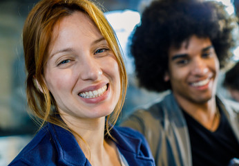 Afro american man and red hair caucasian woman smiling at bar.Multiethnic people having break time in restaurant lounge.Corporate,diversity and social concepts.