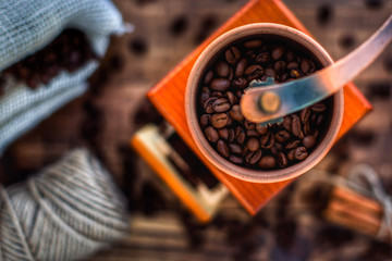 Manual coffee grinder on wooden table table top