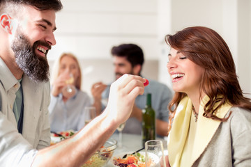 Friends having lunch together at home