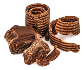 Milk chocolate pieces isolated on white background from top view