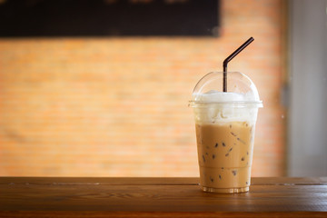 Ice cappuccino in plastic cup. Ready to go packgage. Caffeine beverage. Favorite cool of coffee menu.