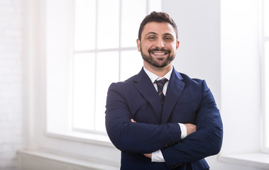 Successful businessman looking at camera and smiling