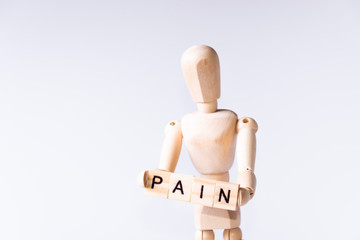 Wood man holding sign pain
