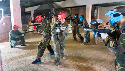 Players are targeting in opponents from cover in battlefield.