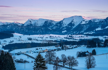 cold winter landscape  in evening light in the Allgaeu Alps near Oberstaufen, Bavaria, Germany