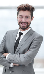 A young man in a gray suit