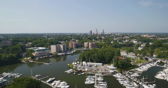 Flying Over a Marina and Towards a Small City in New York