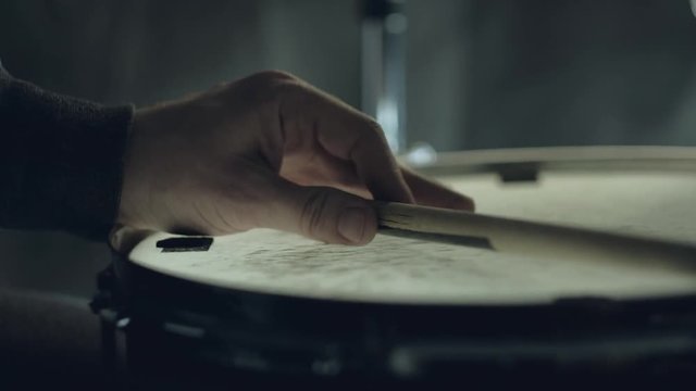 Jazz drummer playing at drums set isolated on black background. 4k. close up.