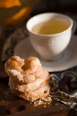 fragrant home-made pastries with hot tea on a wooden tray