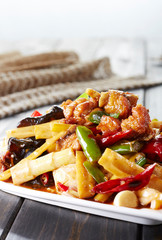 Delicious Chinese food, spicy fried bamboo shoots and pork slices

