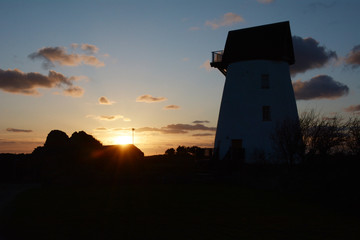 Sunset over Melyn Y Bont restored windmill near Rhosneigr on Anglesey