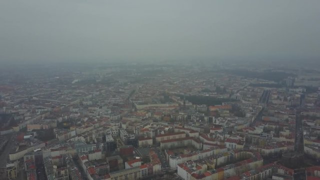 AERIAL: starting really high, lowering down towards the precious Berlin architecture with the cliche red rooftops.