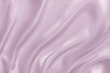 The texture of the satin fabric of lilac color for the background