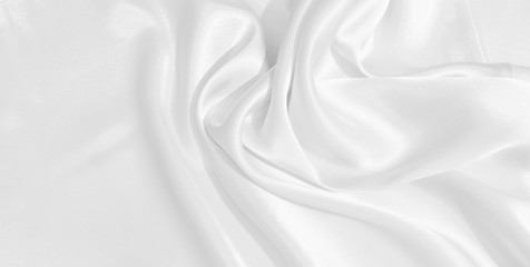 The texture of the satin fabric of white color for the background