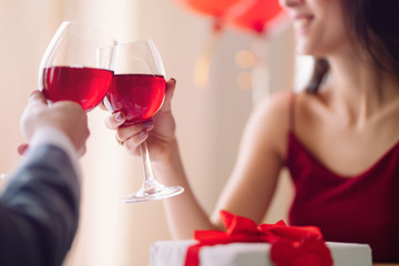 Valentine's Day concept. Happy couple in love with. A young loving couple celebrating Valentine's Day in the restaurant. Lovers give each other gifts. Romance restaurant for Valentine's Day- concept.