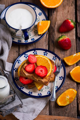 peanut butter toast with orange, strawberry and milk