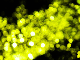 Fototapeta premium Abstract green bokeh circles on a black background. Glamour illustration