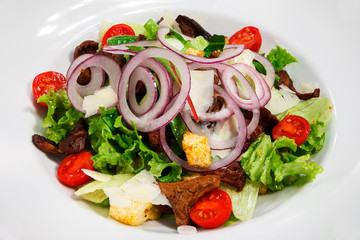 Light fresh green salad with mushrooms and onions