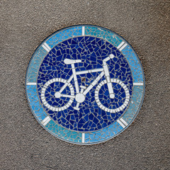 Mosaic in the Shape of Bike on a Bicycle Lane