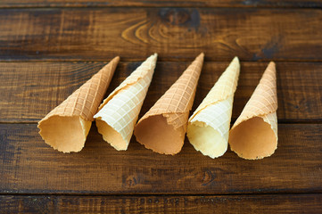 empty ice cream cones on wooden background