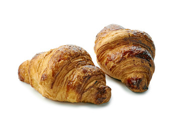Two cryspy and fresh croissants on white