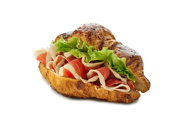 Croissant sandwich with jamon of ham and lettuce on white