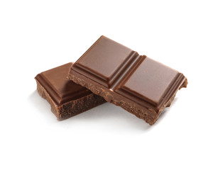 Pieces of tasty milk chocolate on white background