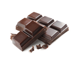 Pieces of tasty dark chocolate on white background