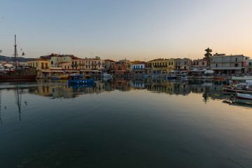 Greece, Crete Rethymno, panoramic view old venetian harbor at the sunset.	