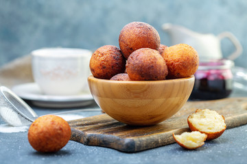 Cottage cheese donuts in a wooden bowl.