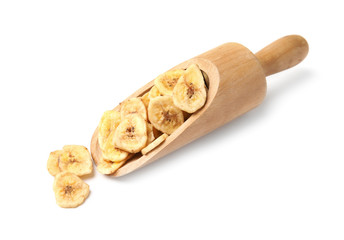 Wooden scoop with banana slices on white background. Dried fruit as healthy snack