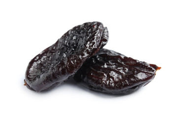 Tasty prunes on white background. Dried fruit as healthy snack