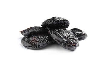Heap of tasty prunes on white background. Dried fruit as healthy snack