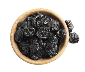 Bowl of tasty prunes on white background, top view. Dried fruit as healthy snack