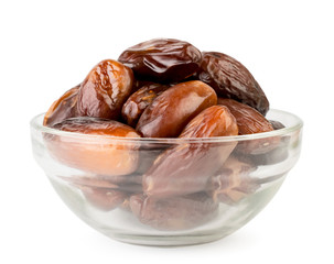Sweet dates in a glass plate on a white, isolated.