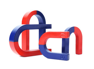 Red and blue horseshoe magnets isolated on white