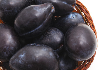 Group of plums in the basket.