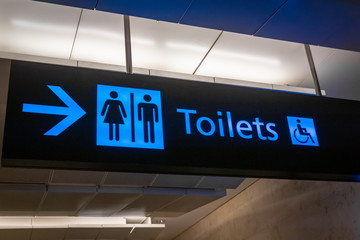 Toilet sign and icon in English at airport