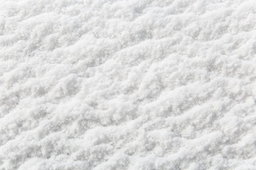 White background for design and decoration. Texture of snow and snowflakes for the New Year, winter holidays.