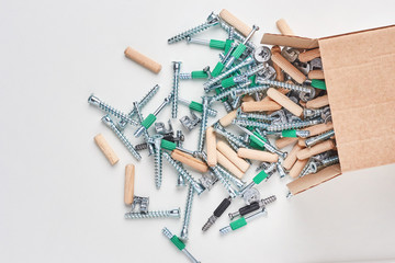 Open box with fall out tools for a furniture assembly, closeup