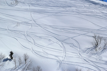 Sunny ski slopes of the snowy mountain resort Rosa Khutor, Sochi Russia