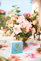 Table number with a peonies on background