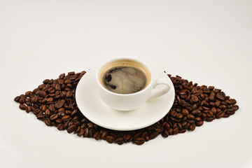 Cup of coffee and coffee beans.
