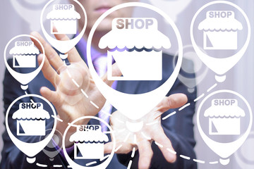 Young businessman working on a virtual screen of the future and sees the icons: FRANCHISE....